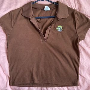 Cute brown collared top by rue 21 in size L , green mushroom design on front.